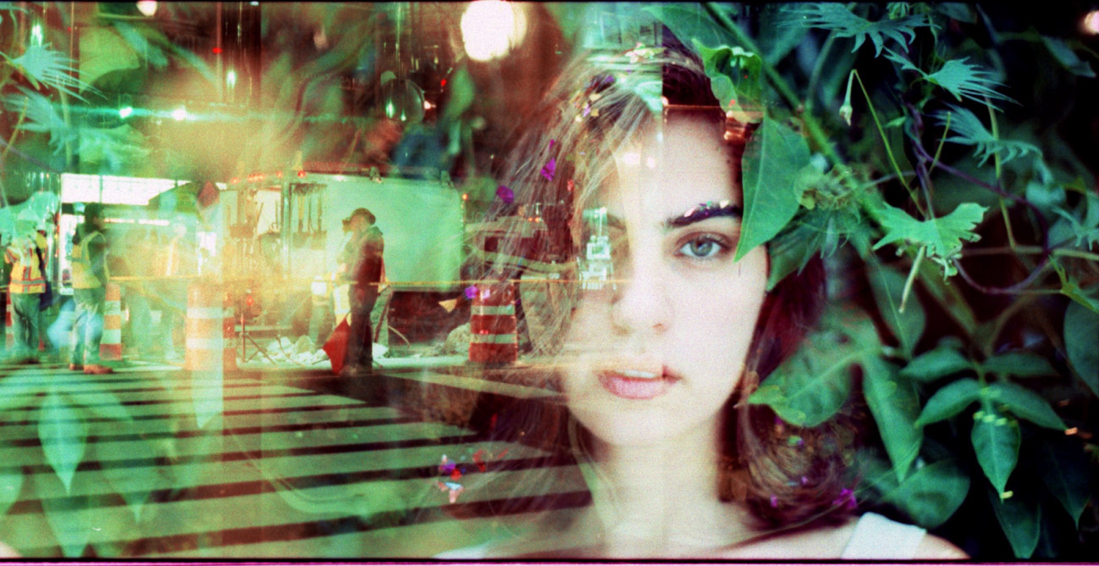 In-camera multiple exposure combining a portrait, a street, and foliage