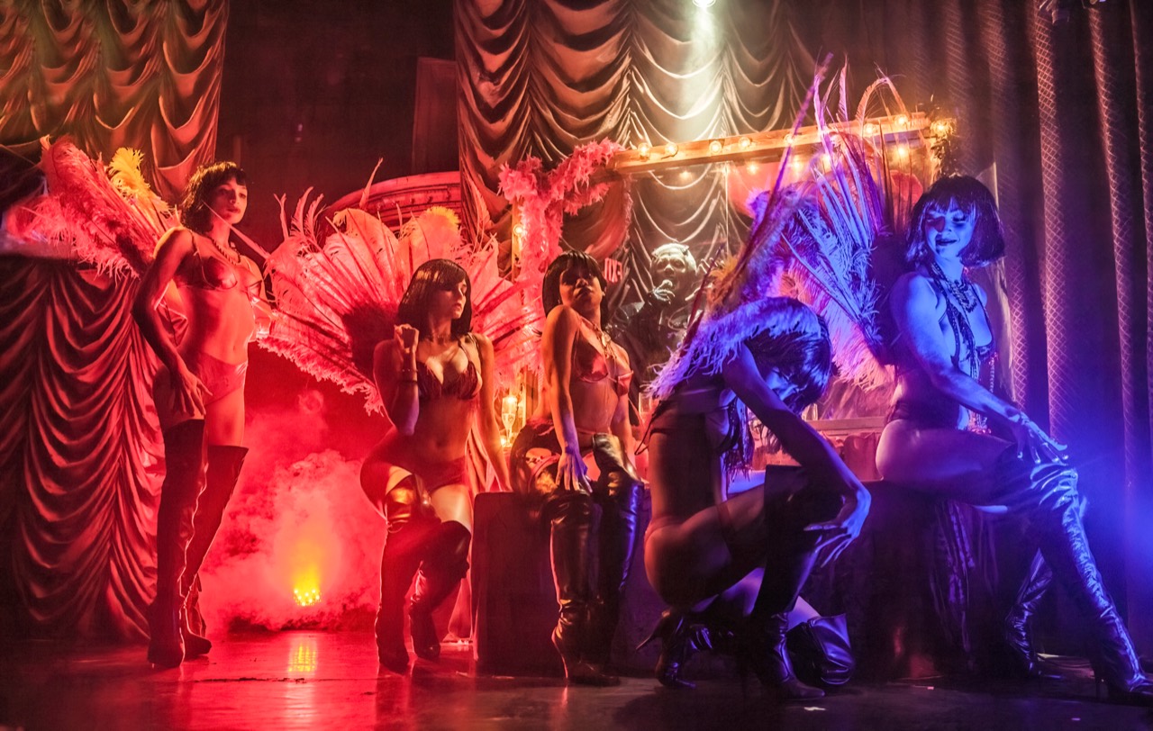 A group of performers onstage at The Box, photographed by Laura Weyl